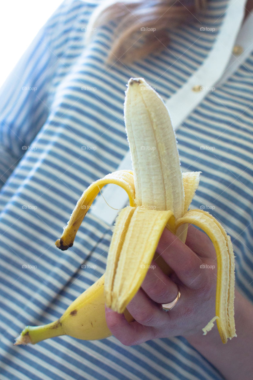 Girl holding a banana