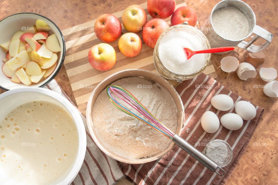Making homemade puffed apple pie with eggs, sugar and flour.