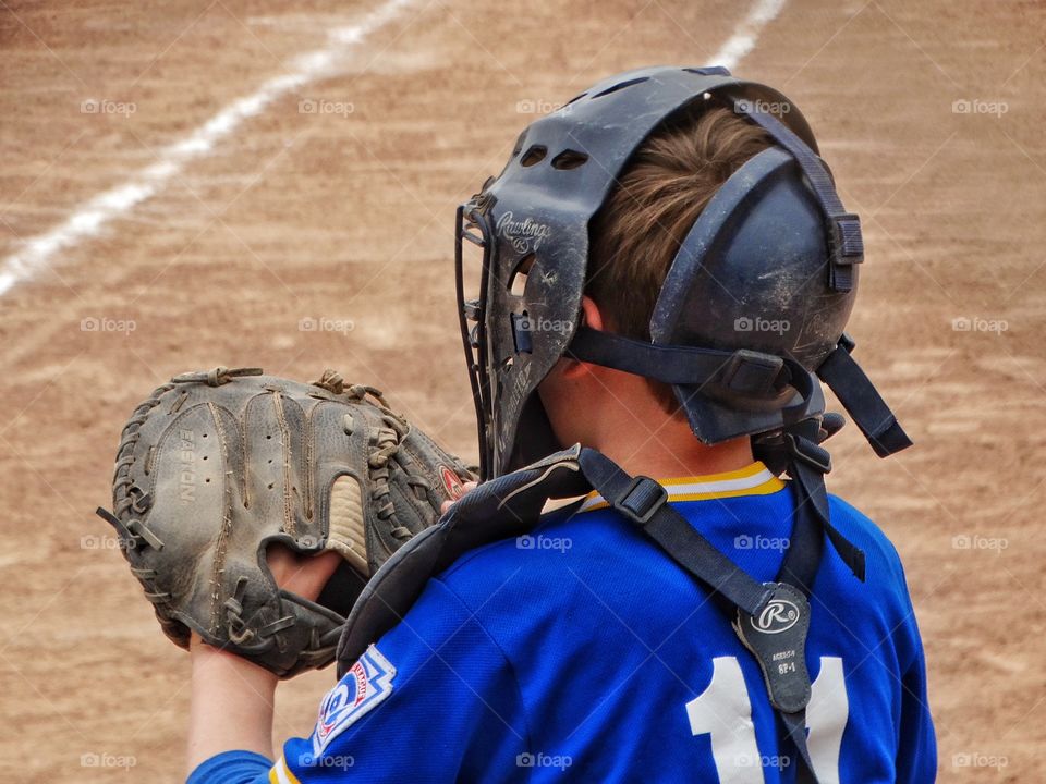 Young Baseball Catcher. Young Boy In Little League Playing Catcher Position
