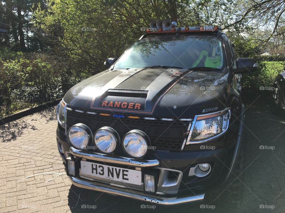 Stand out car in a car park ... not everyday you see three headlights above a number plate 