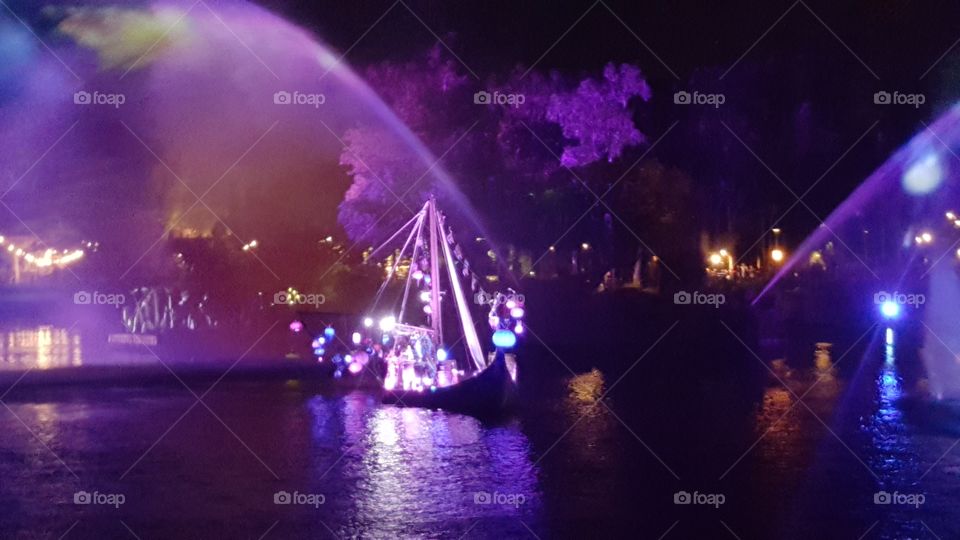 The must in the sky lights the way for an illuminated ship on Discovery River during Rivers of Light at Animal Kingdom at the Walt Disney World Resort in Orlando, Florida.