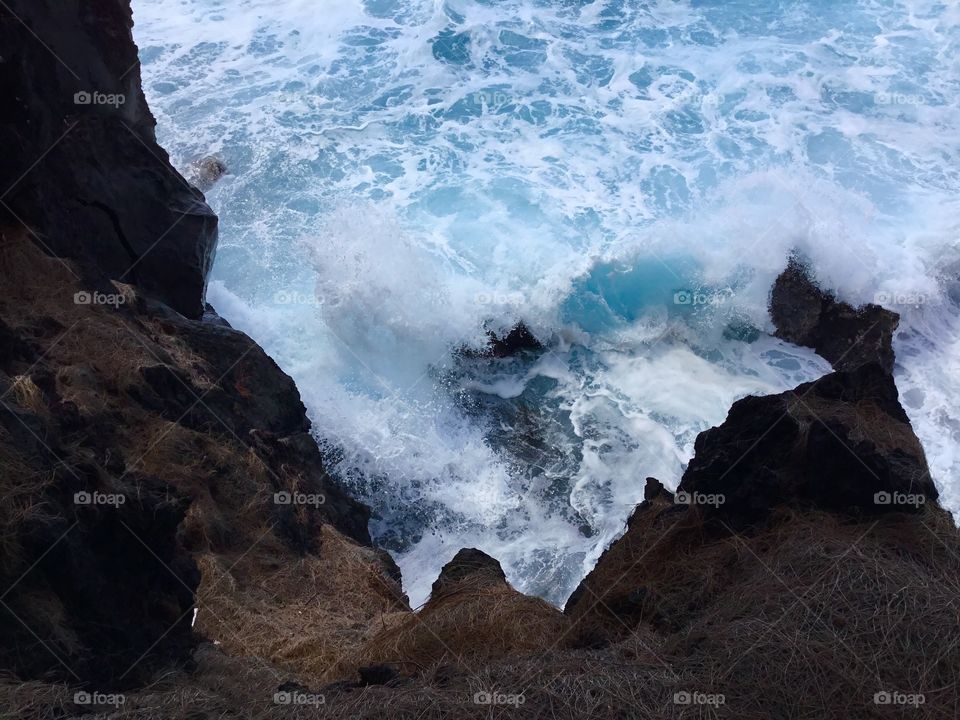 Waves hitting the lava rocks