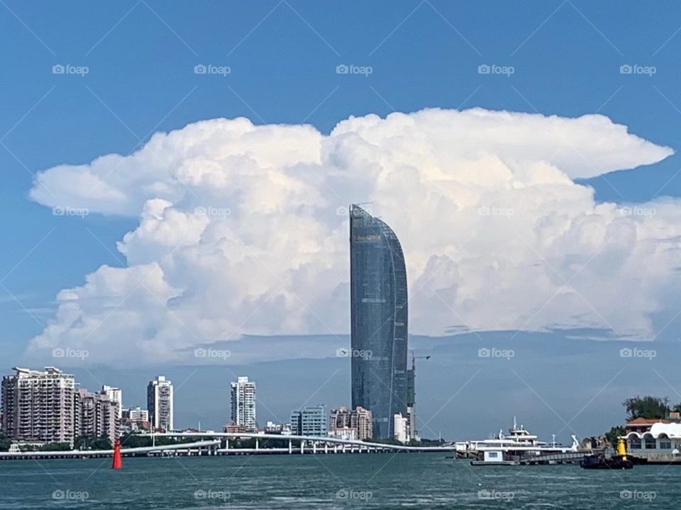 See the real blue sky and white clouds, Xiamen Twin Towers in China.