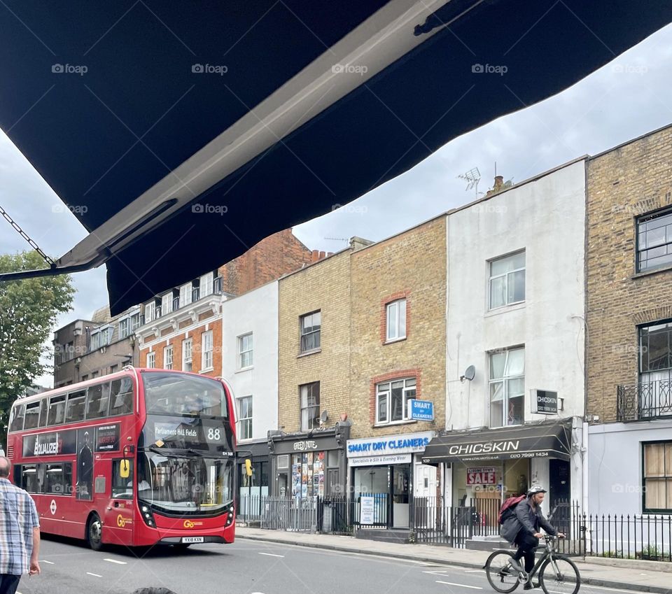 London double decker bus chasing cyclist