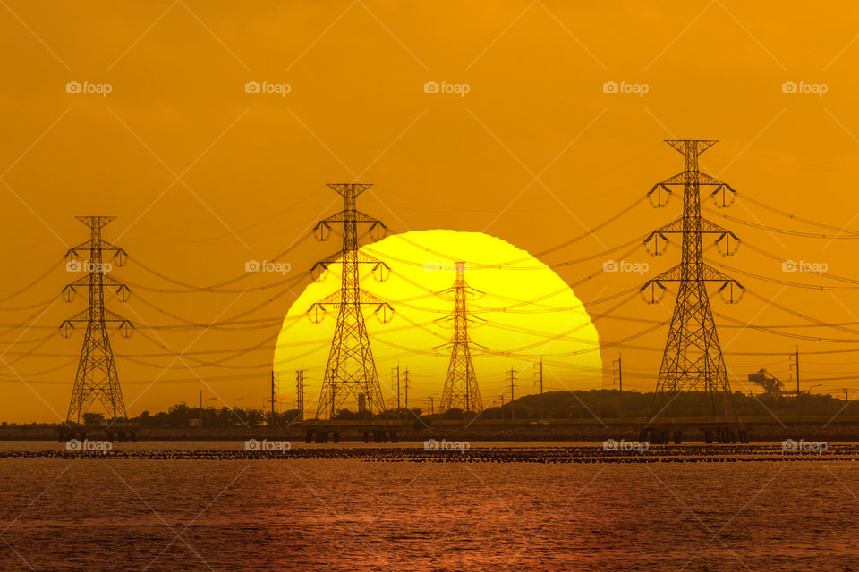 Electric tower with sunset