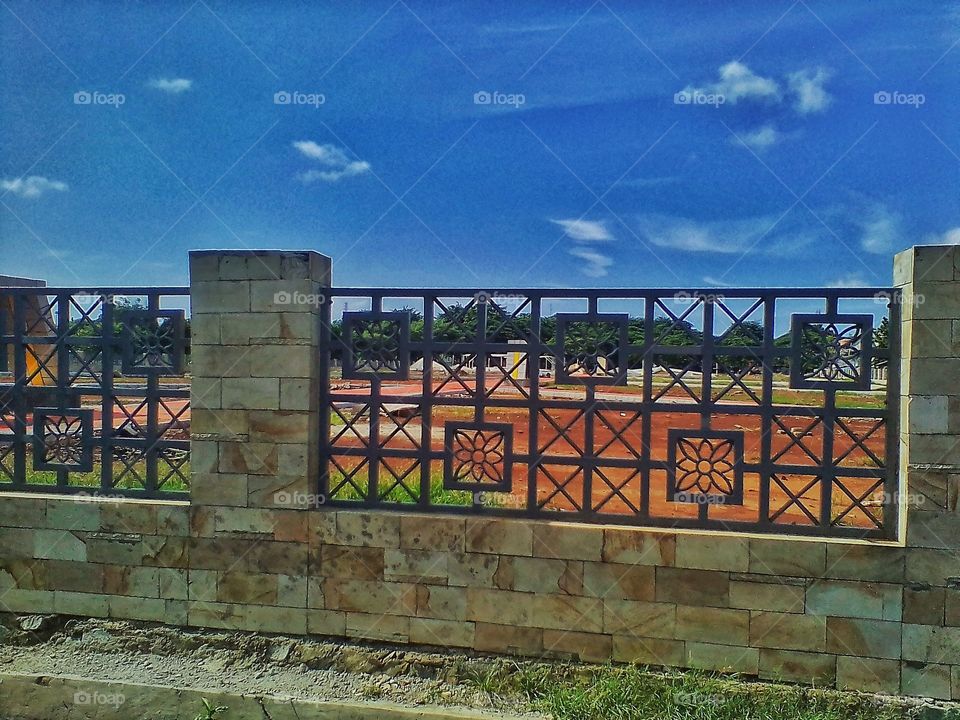 The fence in the public cemetery area is neat and nice