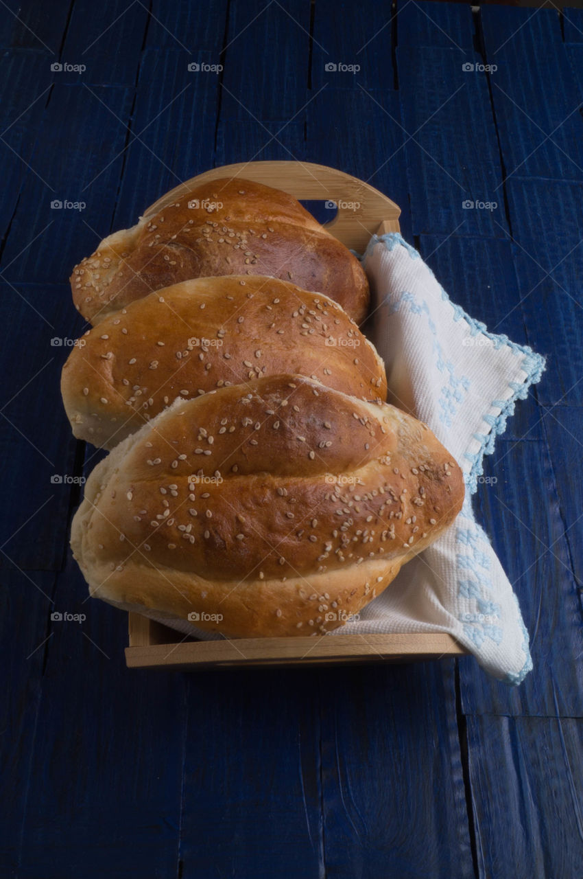 bread homemade with napkins and blue table