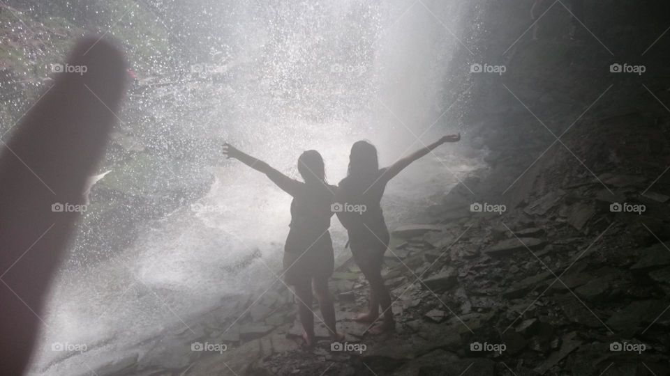 waterfall chasing in Ontario Canada with friends caught in a water spray