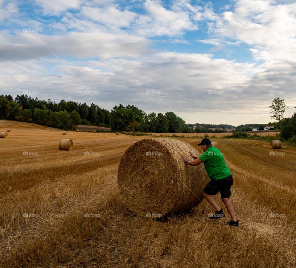 countryside working before winter. Working with the hay and hayballs. 
alot to do before Winter is coming