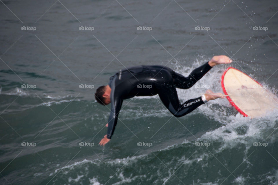 Surfer wiping out on the shores of California