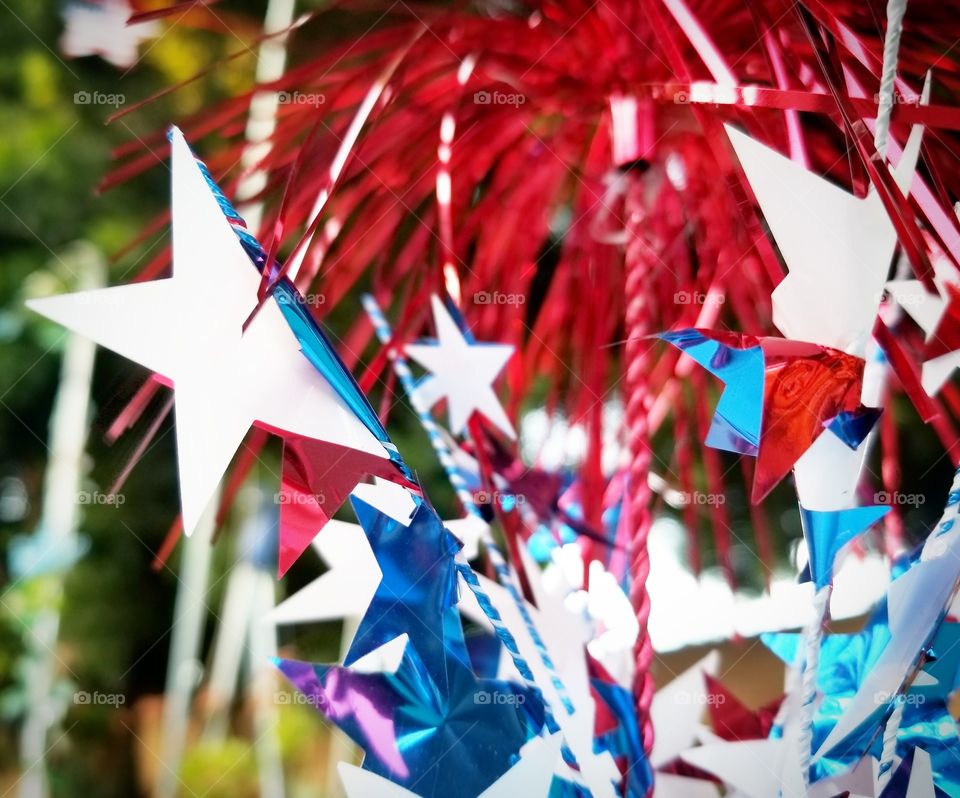 Party decor with stars made of foil cut outs