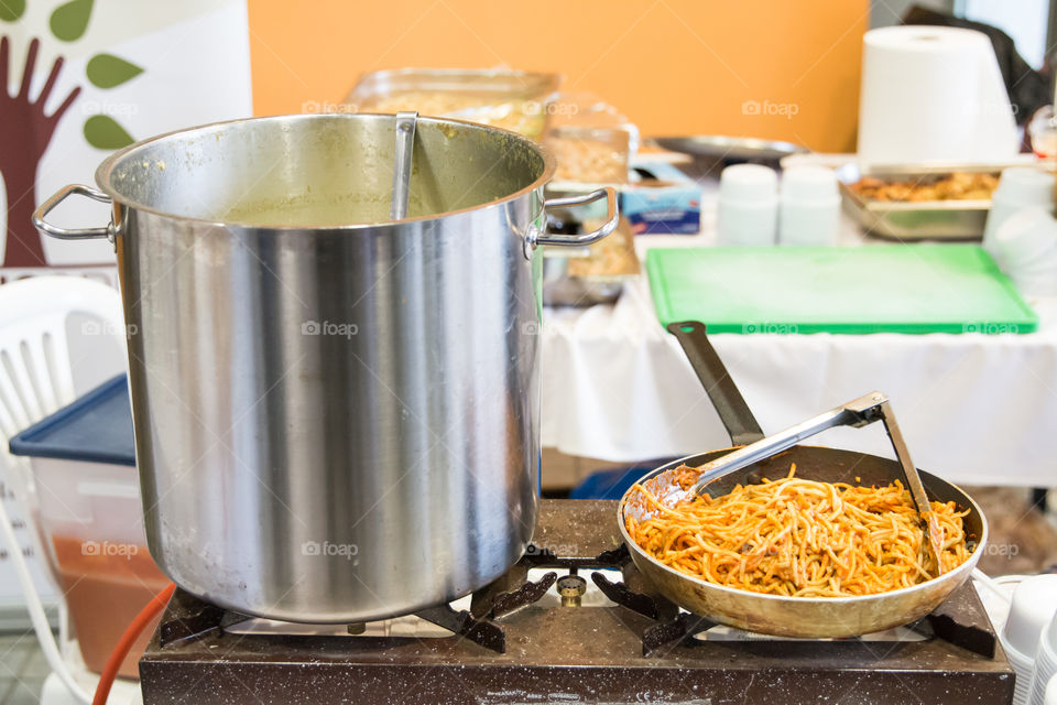 Pasta Macaroni In A Frying Pan And Soup In A Big Pot Ready For Serving
