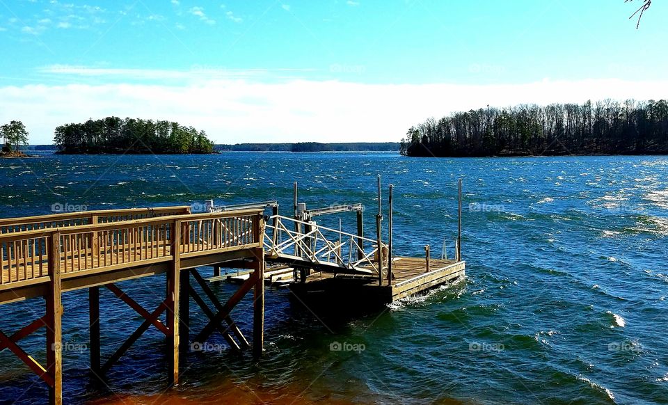 dock on a windy day bouncing on the waves.