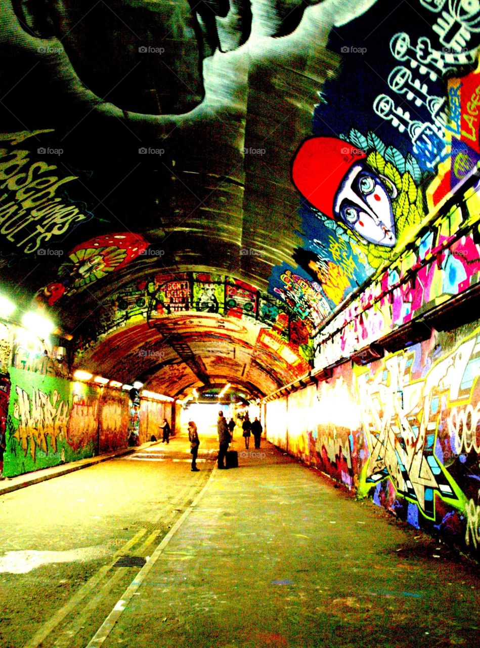 Artists in the Leake Street graffiti tunnel, London