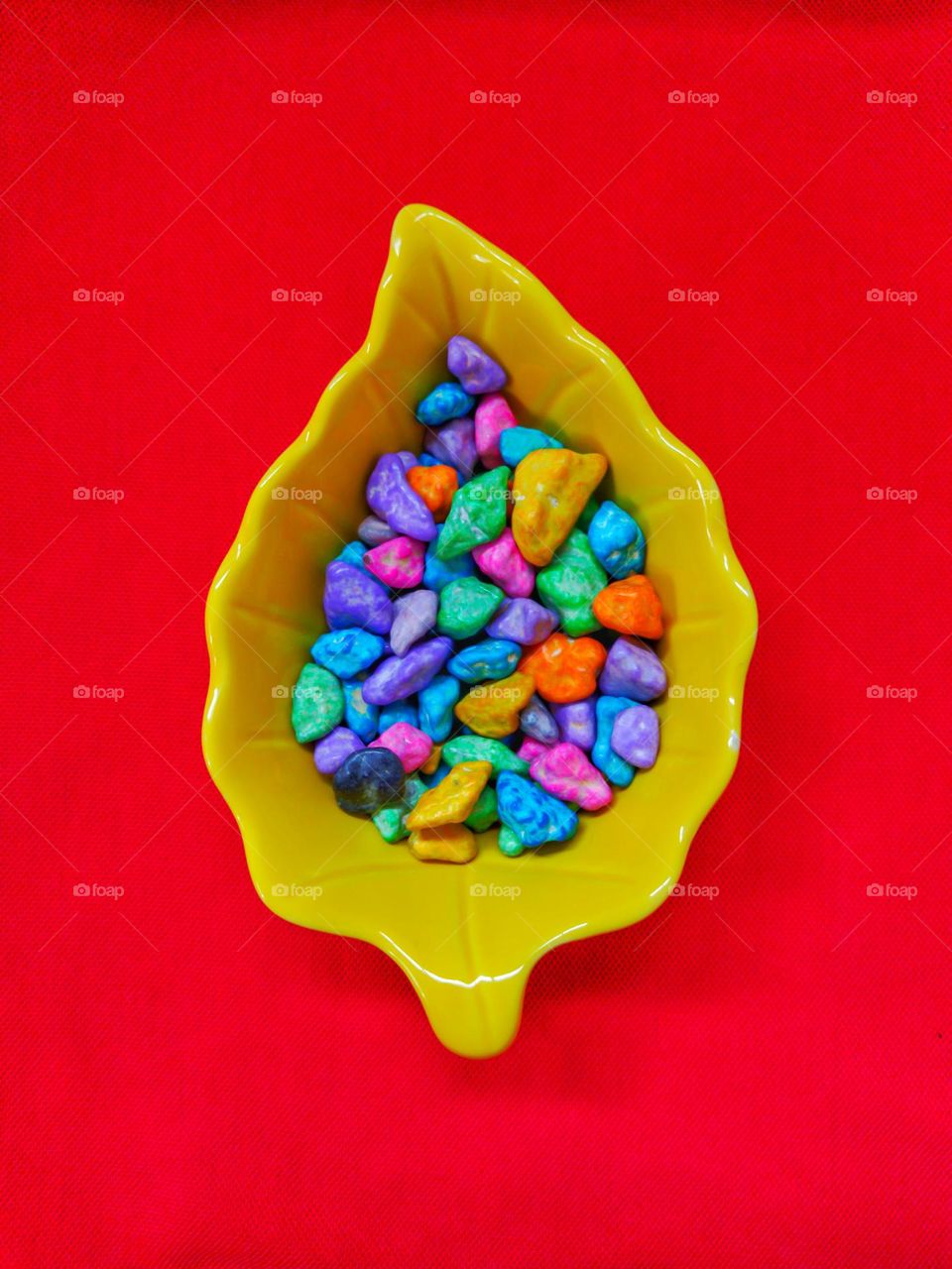 colorful chocolate in the glass dish , colorful background