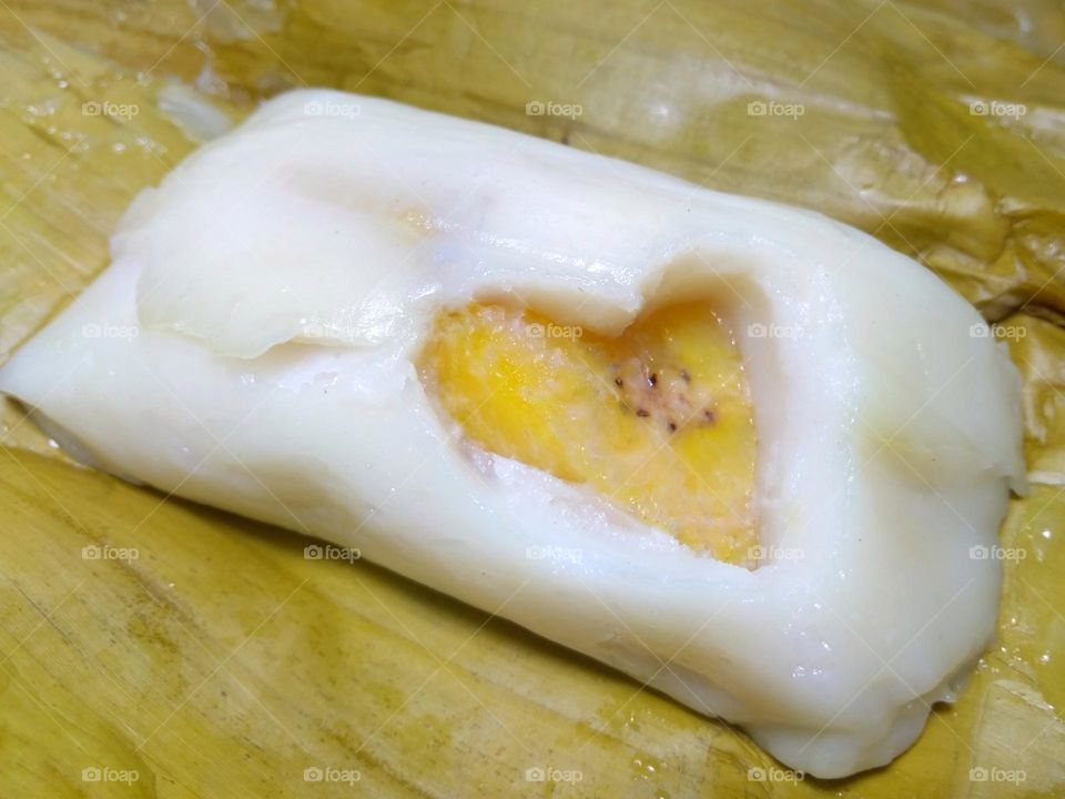 Flour Dough Stuffed With Banana Steamed in Banana Leaf