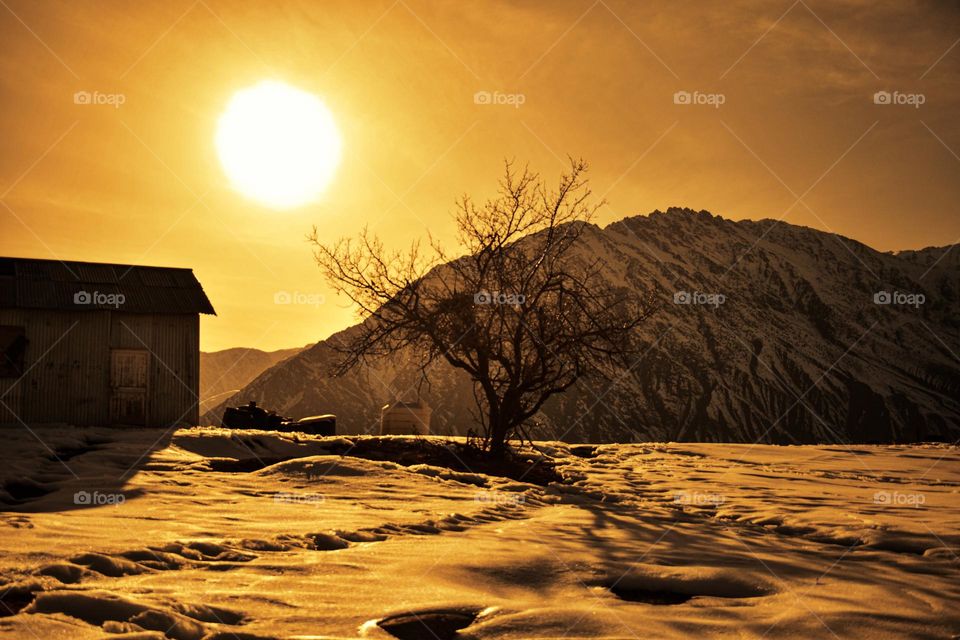 golden hour winter landscape and abandoned building