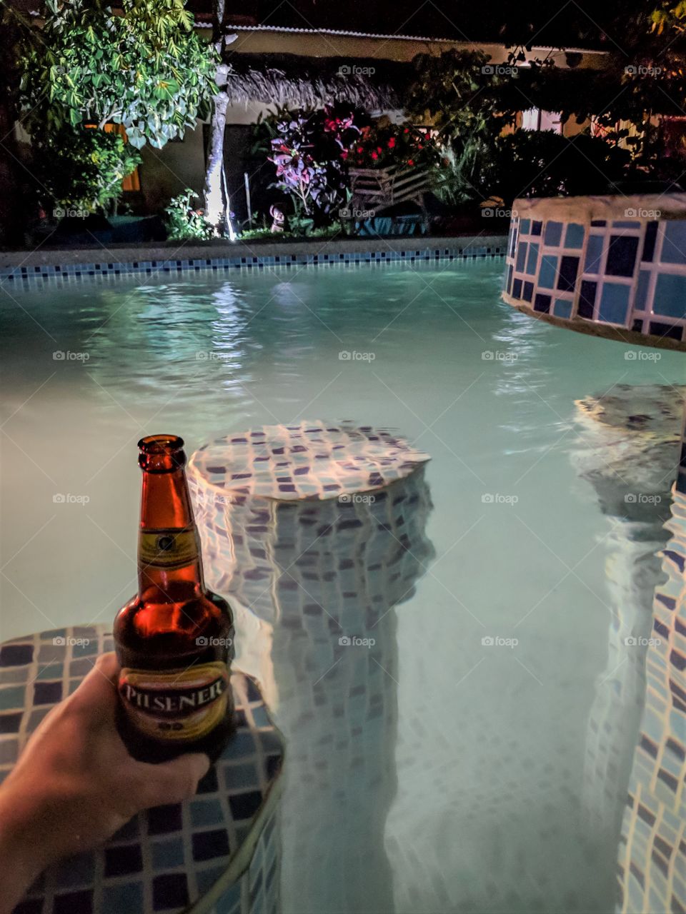 Sipping cold beer in the warm pool