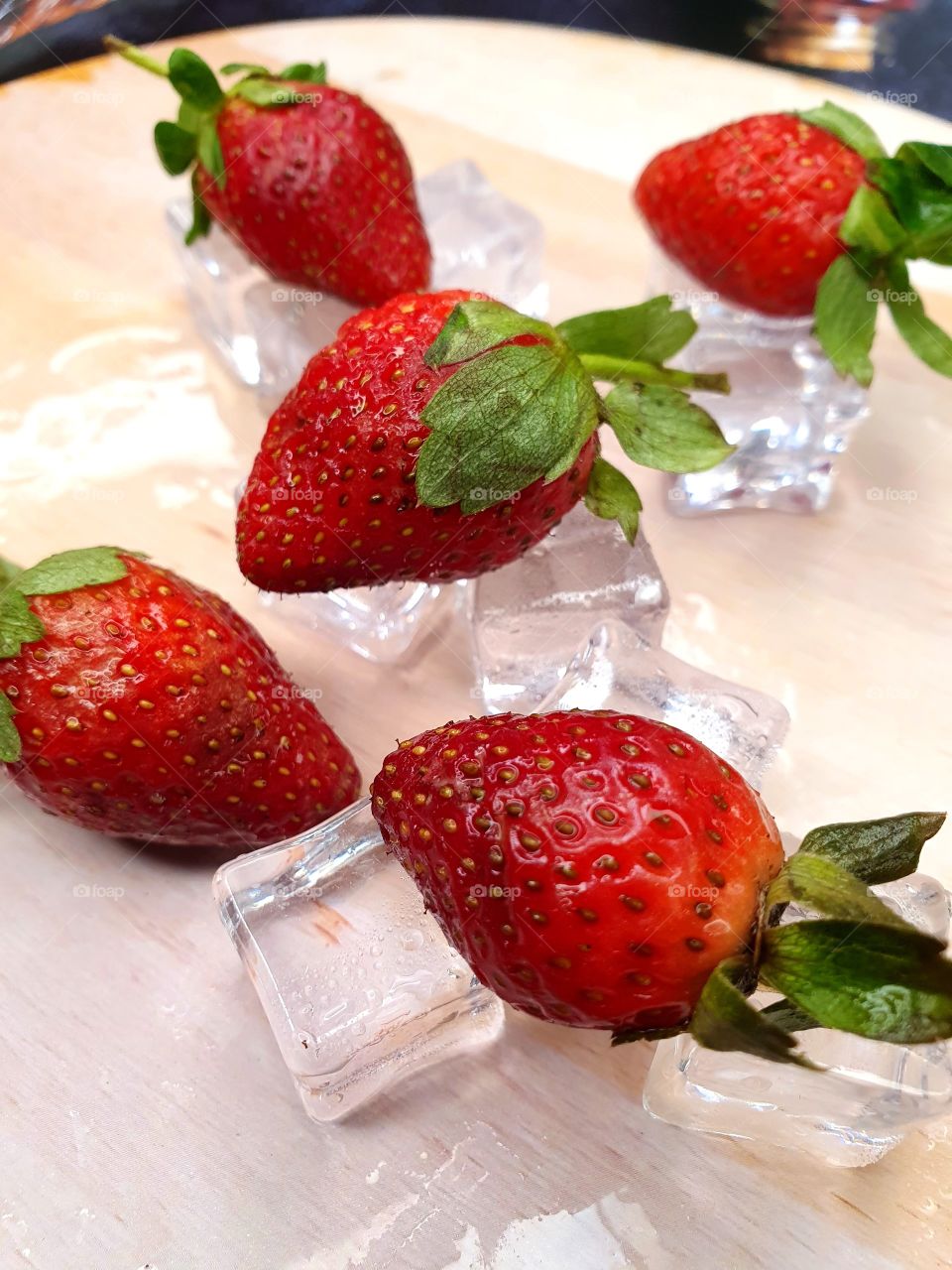 Strawberry and ice cube