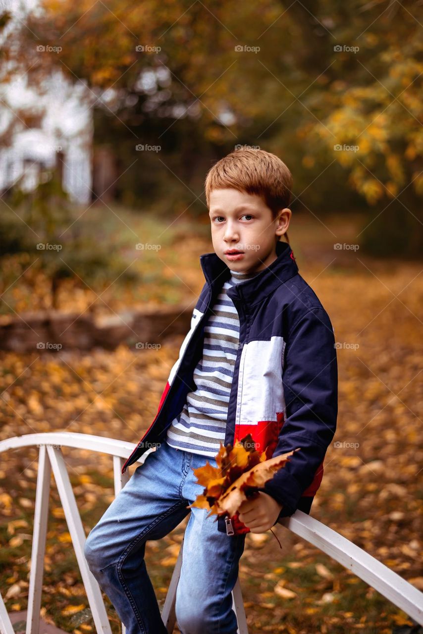 red-haired boy child, bright emotions sadness