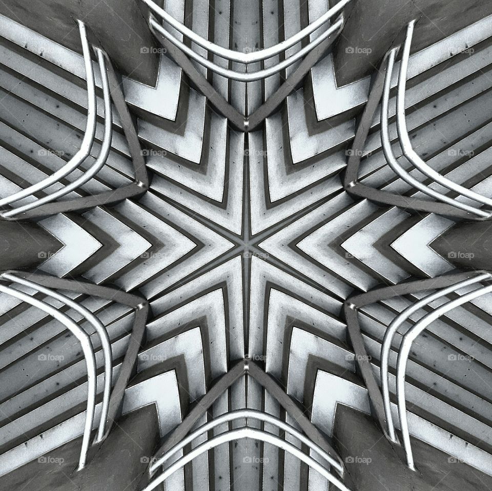 I took a shot of some stairs and put a mirror effect like a kaleidoscope on them creating a unique multi-directional staircase effect