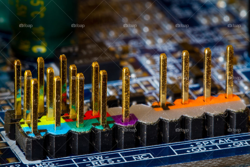 Macro image of computer motherboard electronics showing different colors and shapes