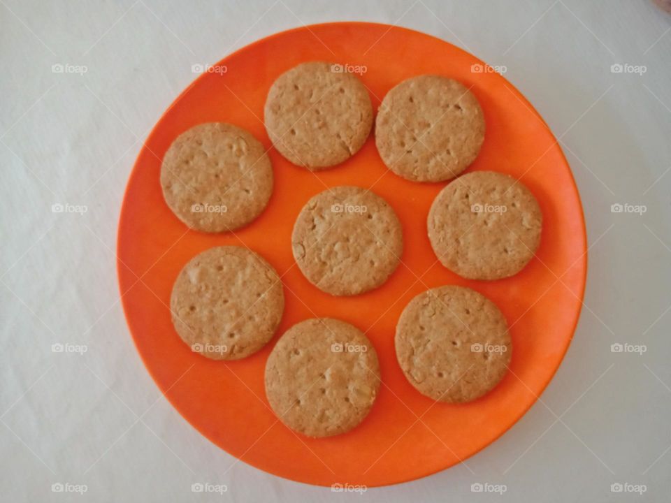 round biscuits in an orange plate