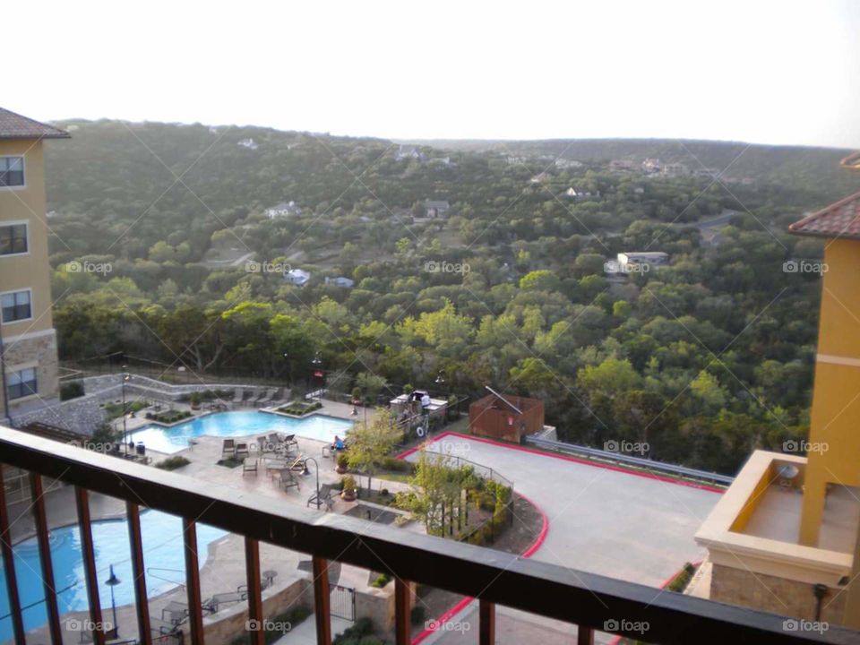 View of pool and landscape from top floor of apt complex in Austin.