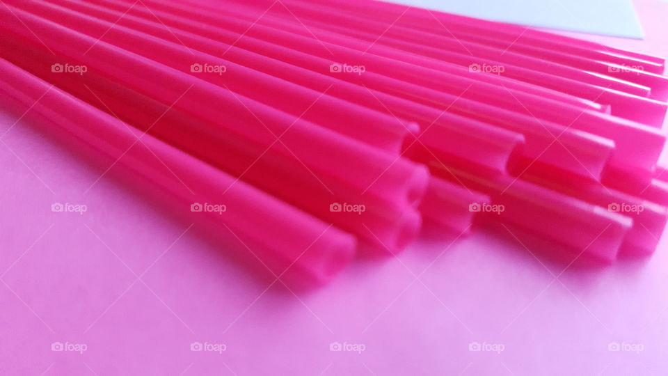 Close-up of pink straws