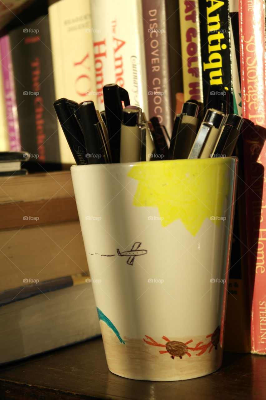 Light on a cup of pens