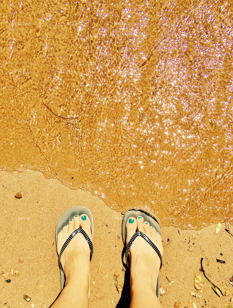 Flip flop kinds Summer. Blue toe nails. Cool water and sand are the cure for a hot day.