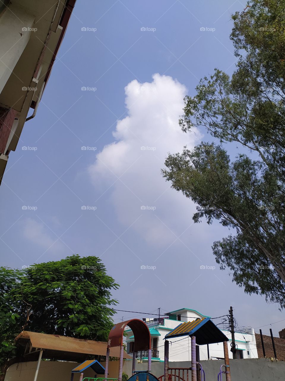 Last clouds of monsoon in the blue sky