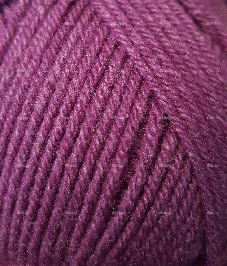 Full frame of purple yarn