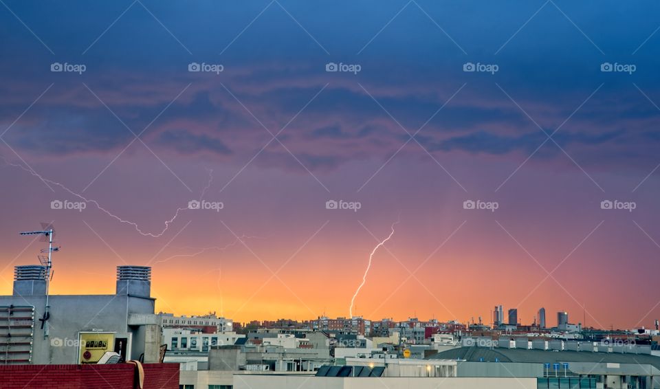 Lightning storm at sunset over Madrid city
