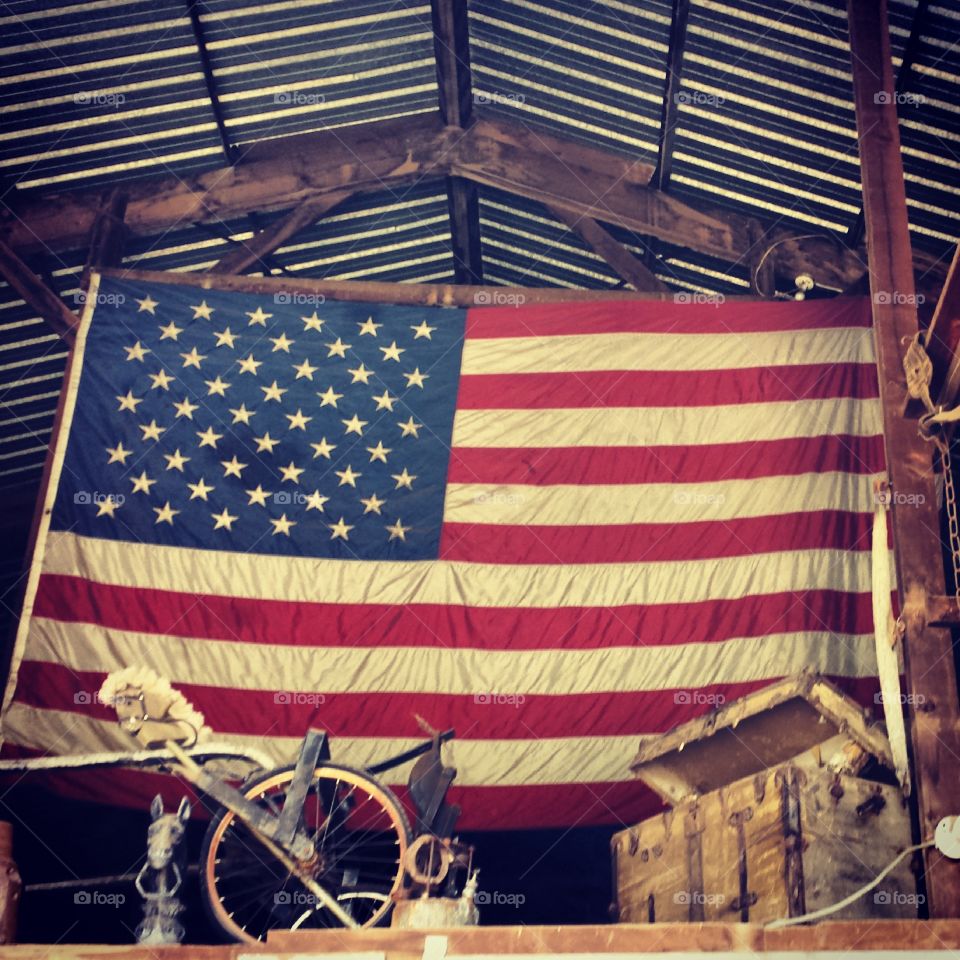 USA. flag in a barn