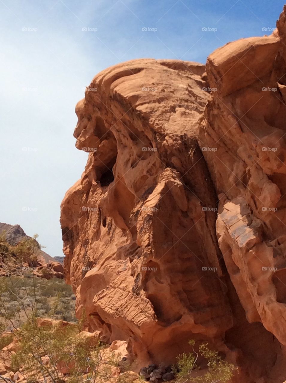 Lake  Mead. Lake Meade has a section where you can sit and have a snack and has a lot of rock and mountains near by.