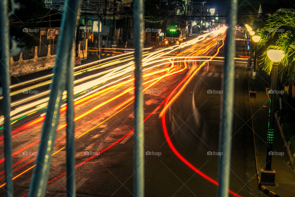 street lights with lighstreaks. street lights and light streaks from cars passing by