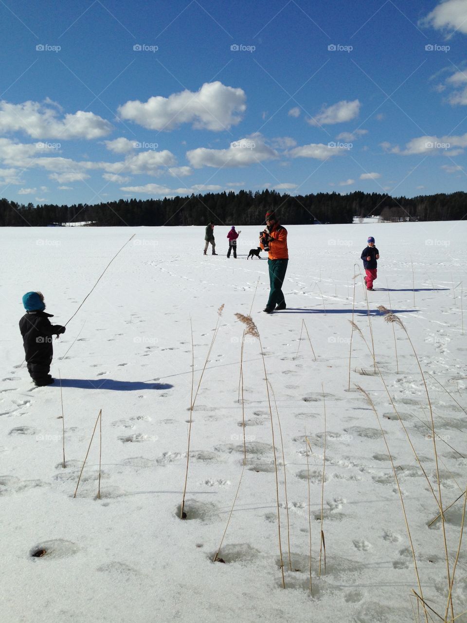 Family fun on frozen lake