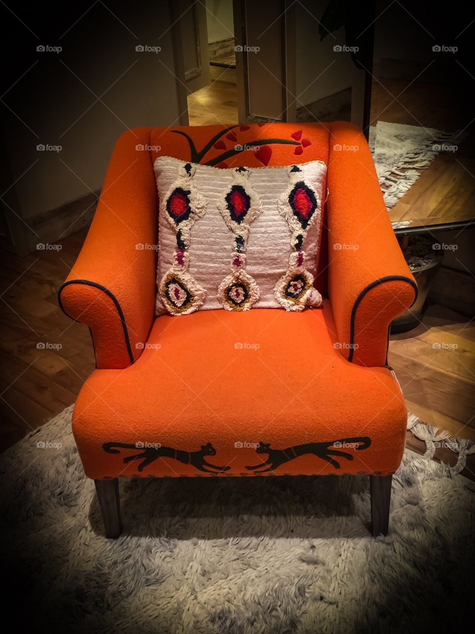 Beautiful orange coloured chair in a local clothing shop