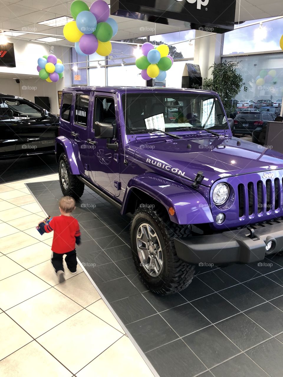 Toddler and purple Jeep 
