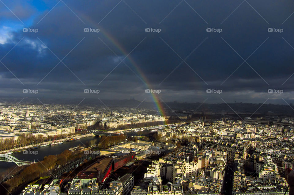 Rainbow over Paris city