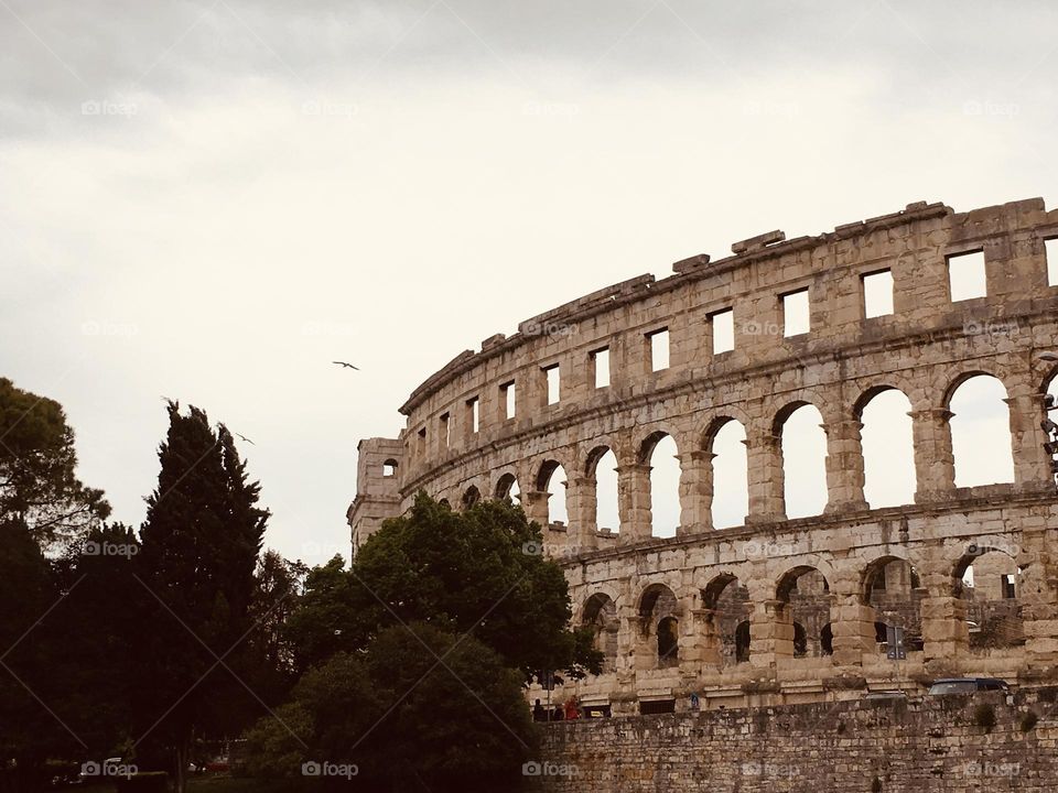 Vintage photo of a historical Roman Colosseum in Pula, Croatia.