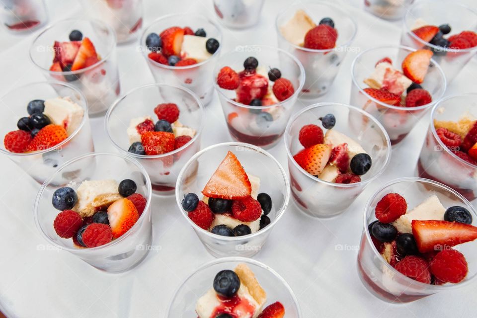 desert cups with strawberries, blueberries and raspberries