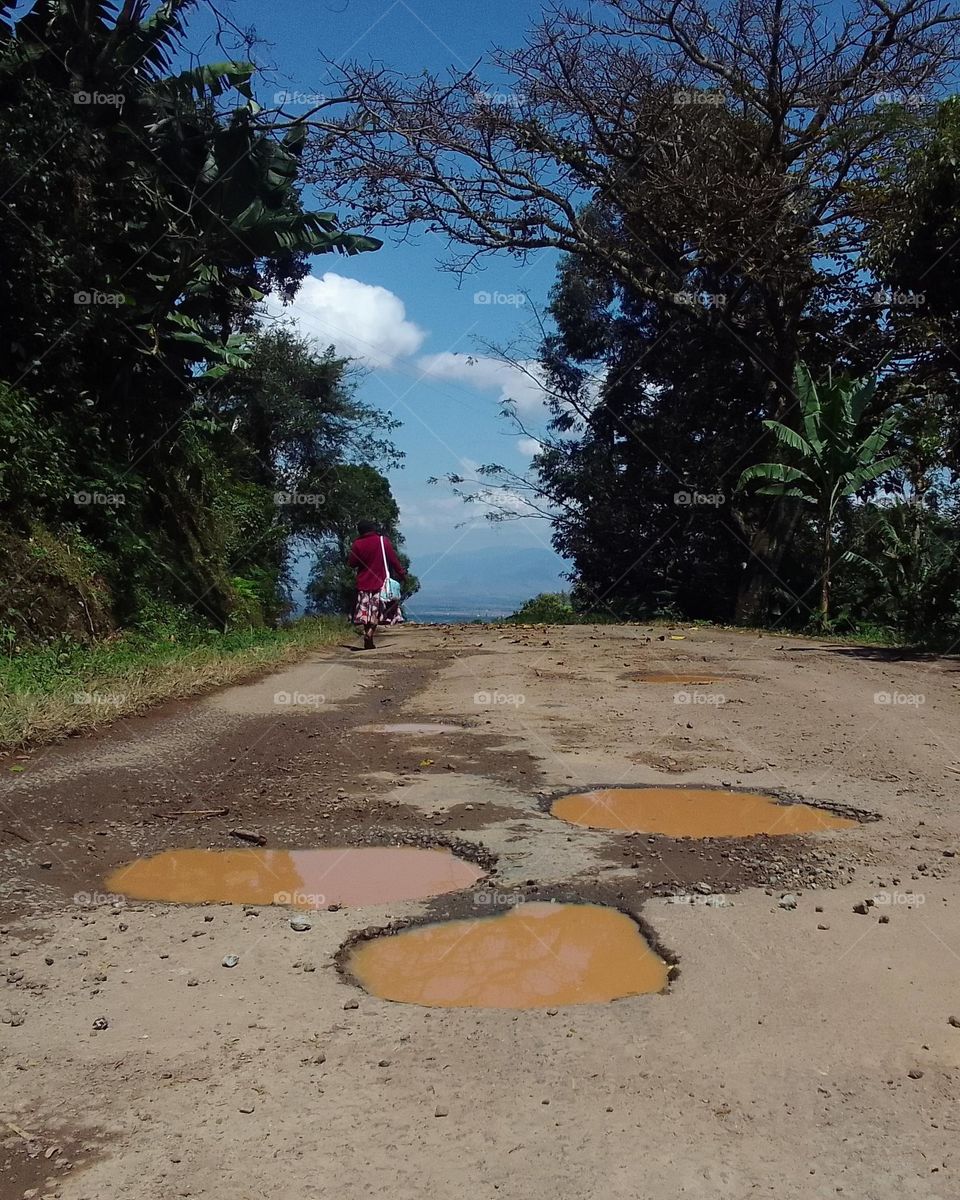 Puddles of water on one of the old Kilema road.