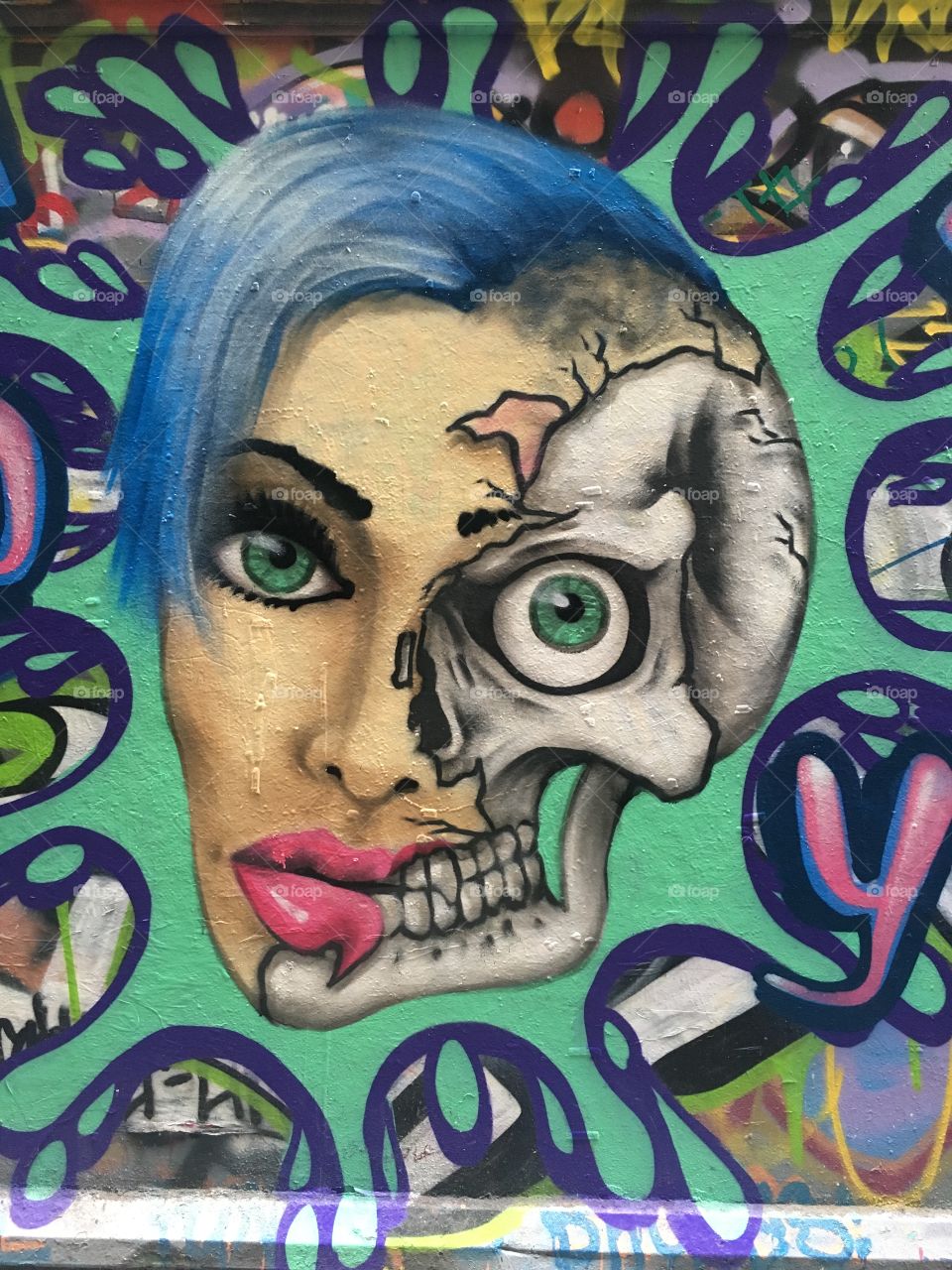 Graffiti woman's face half dead