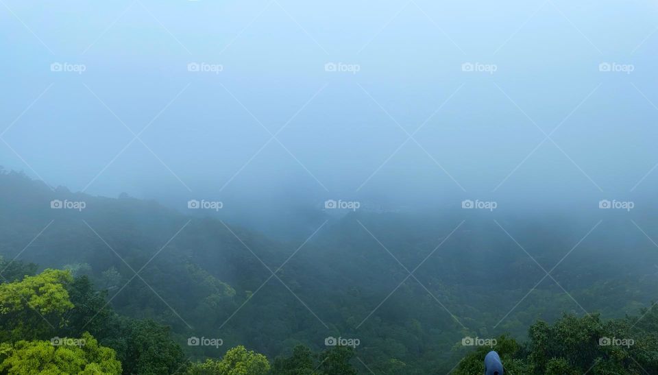 surrounded by clouds