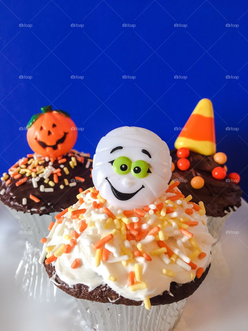 A collection of Halloween themed cupcakes.