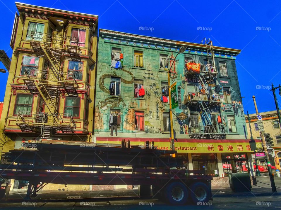 Laundry hanging off Chinatown apartment building