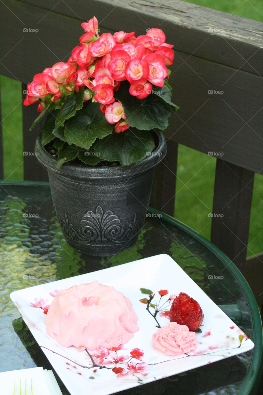 Angel Food Cake with Strawberry Jello and Cool Whip with rose shaped strawberries 