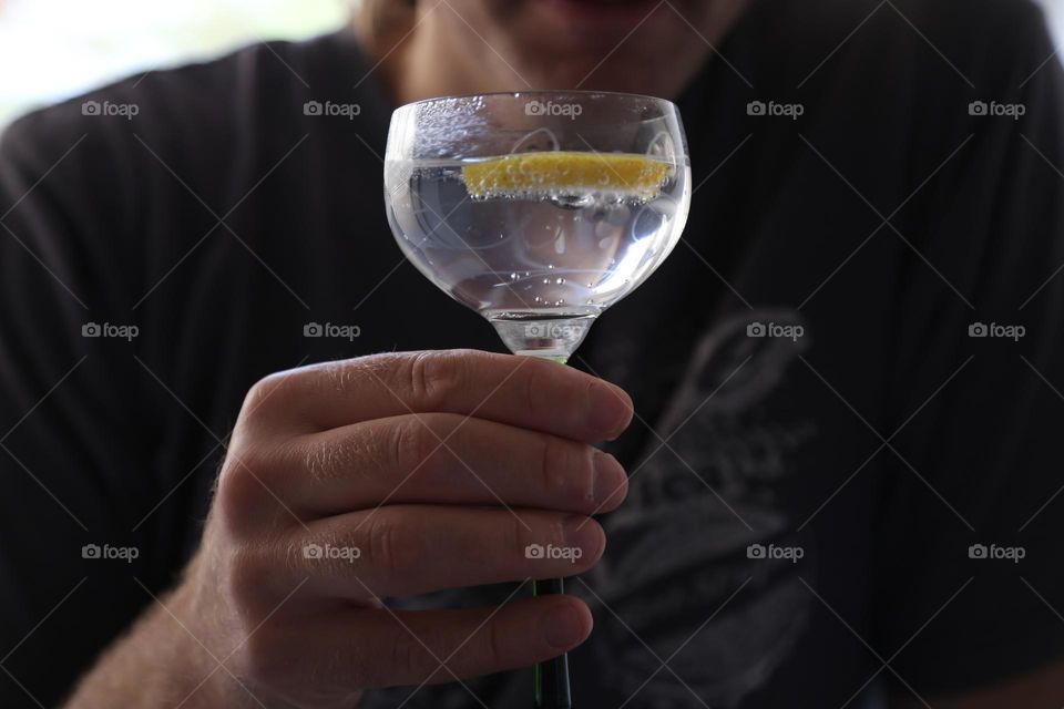 Drinking water with a lemon slice 